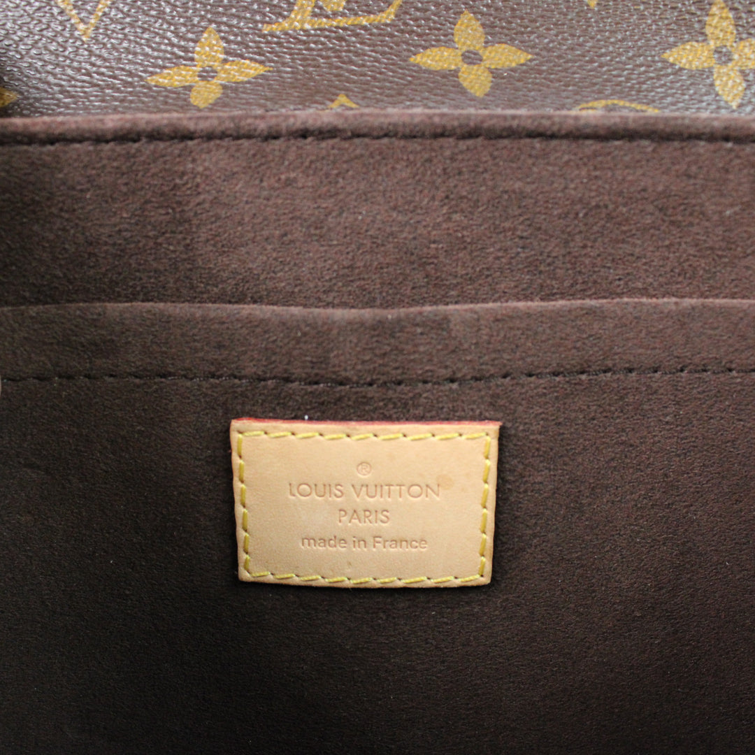 Louis Vuitton Metis Clutch